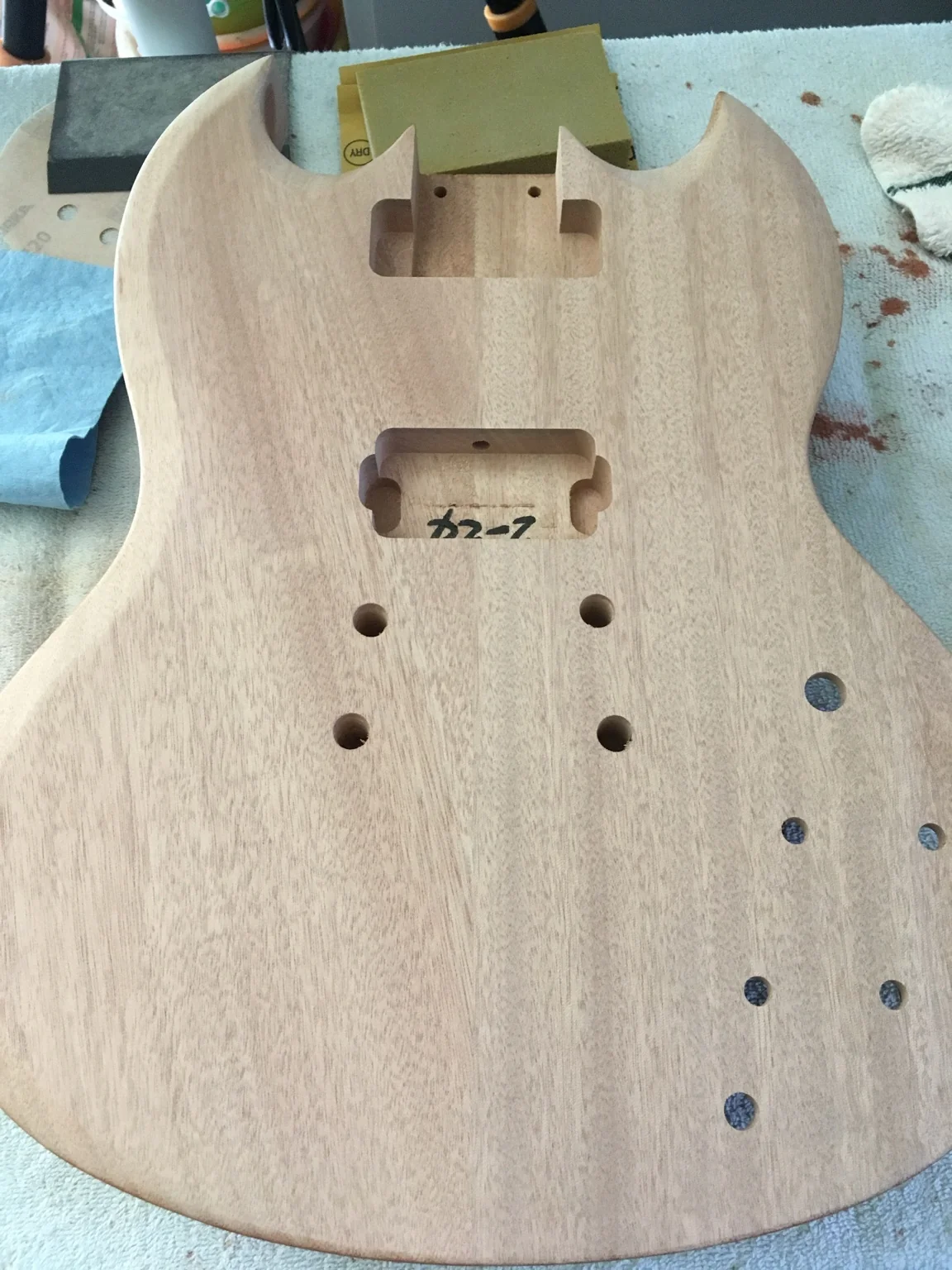 Before: unfinished mahogany body