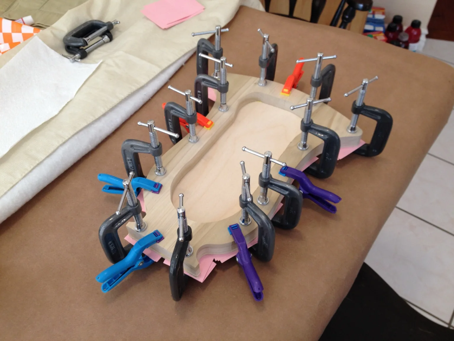 Handmade lyre construction: clamping the body