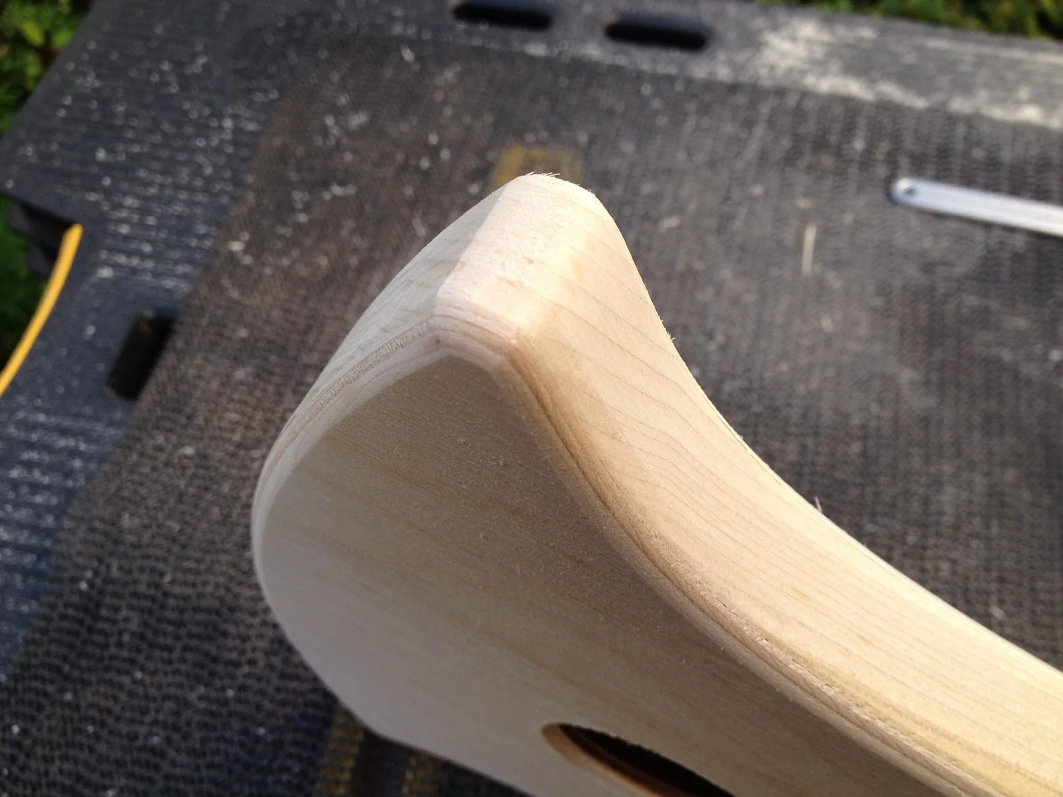 Handmade lyre construction: smoothing the rounded contours