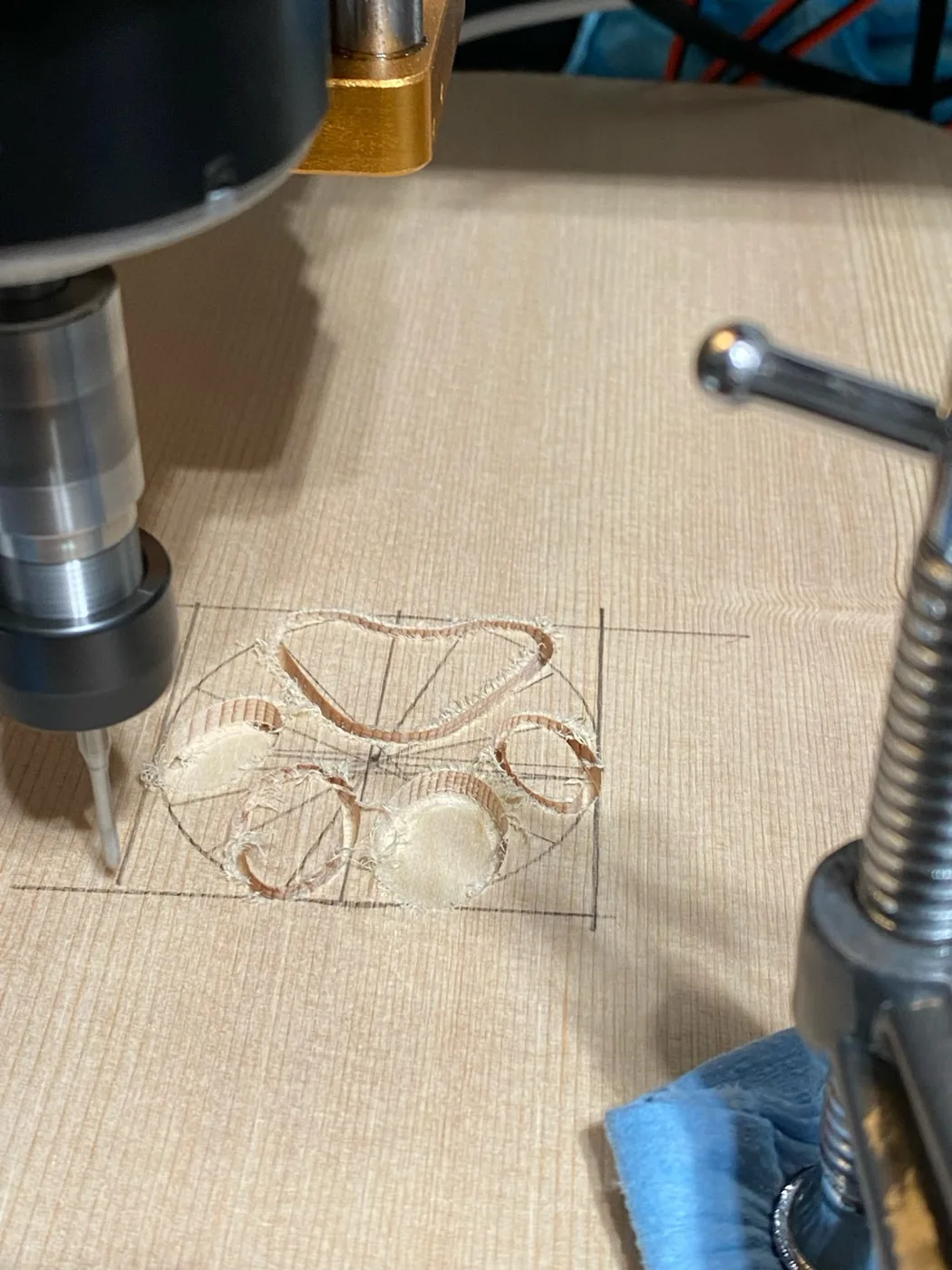 Pug-a-lele construction: carving the paw-print sound holes